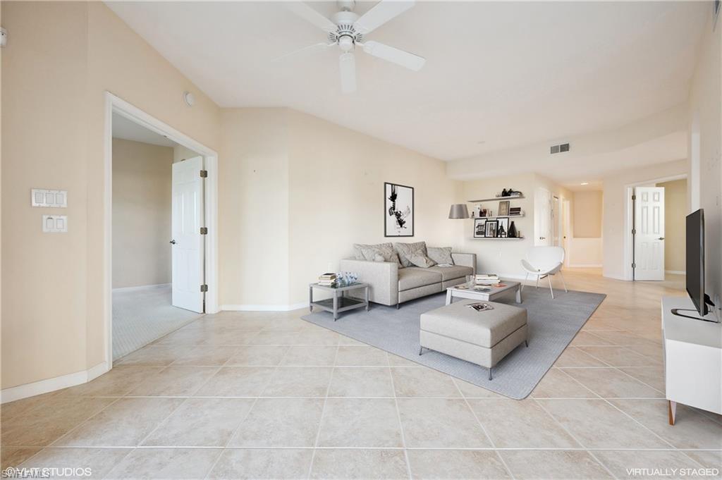 22931 Rosedale Drive, Unit 101 Estero, FL 34135 - Photo 7 of 35 a living room with furniture and a flat screen tv