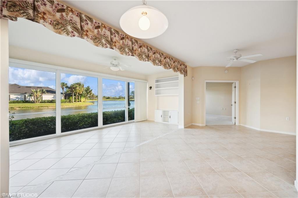 22931 Rosedale Drive, Unit 101 Estero, FL 34135 - Photo 9 of 35 a view of an entryway with a floor to ceiling window and an entrance