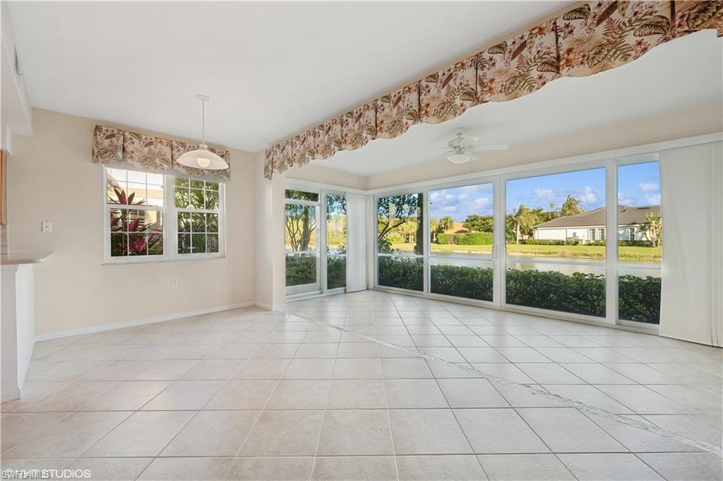 22931 Rosedale Drive, Unit 101 Estero, FL 34135 - Photo 10 of 35 a view of an entryway with a floor to ceiling window and front door