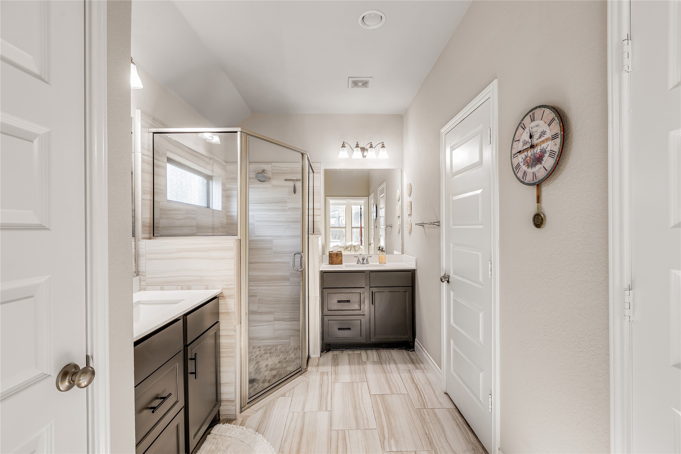 220 Freeman Loop Liberty Hill, TX 78642 - Photo 26 of 40 Primary bathroom with separate vanities, storage and great closet space.