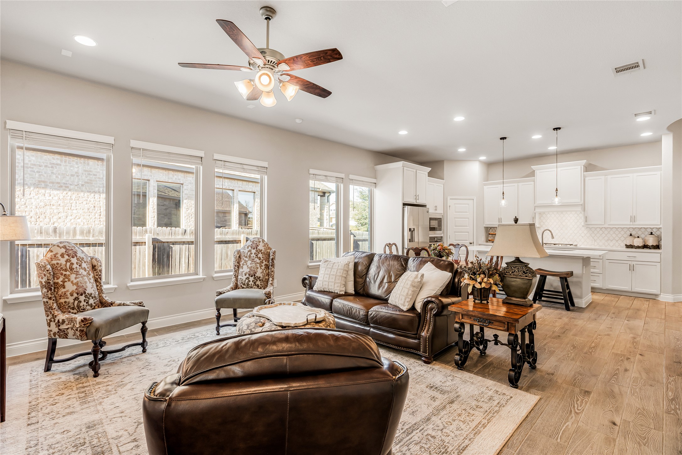 220 Freeman Loop Liberty Hill, TX 78642 - Photo 4 of 40 Wonderful, open living/dining/kitchen area creates an inviting atmosphere.