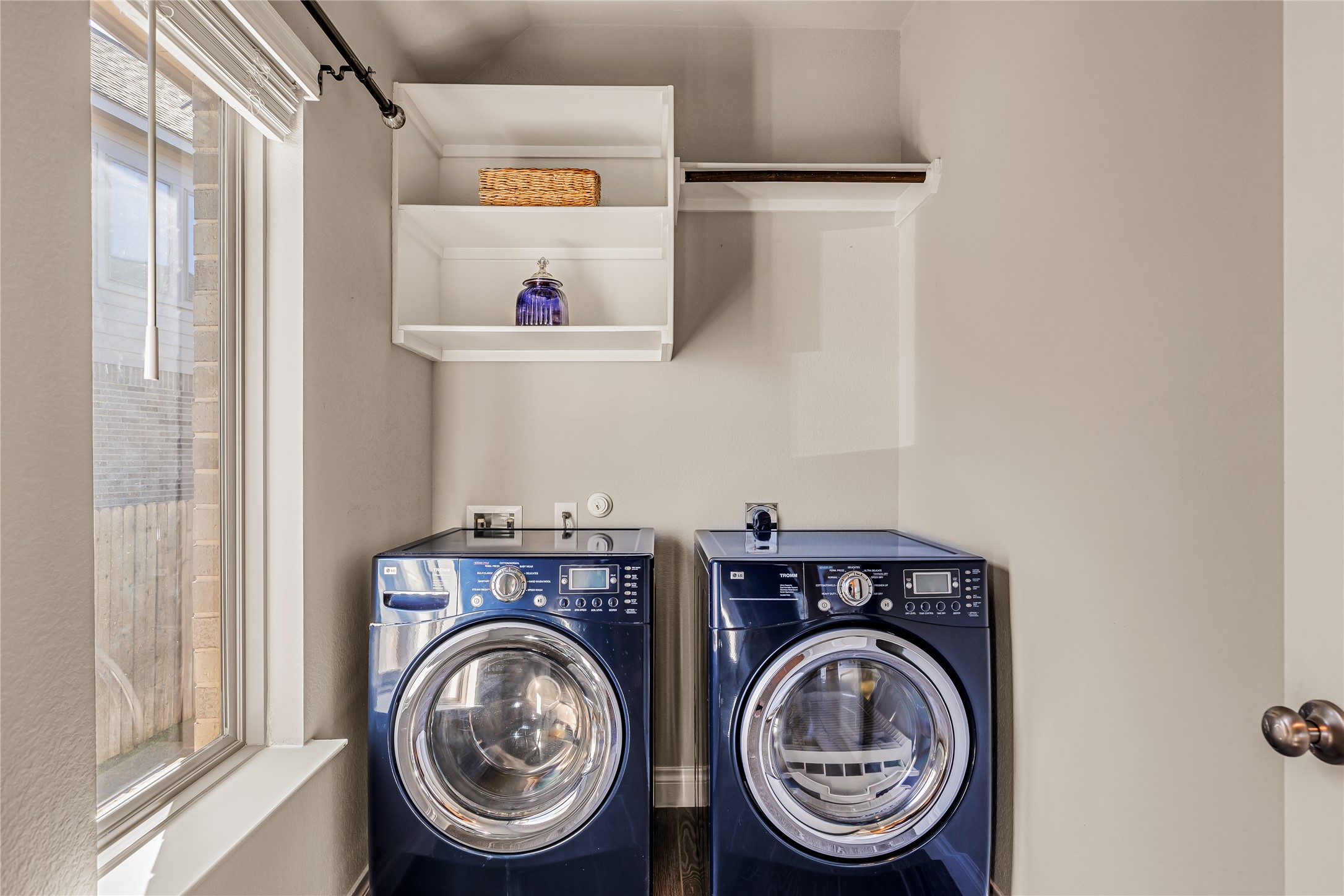 220 Freeman Loop Liberty Hill, TX 78642 - Photo 9 of 40 Laundry room with built-ins and shelving.
