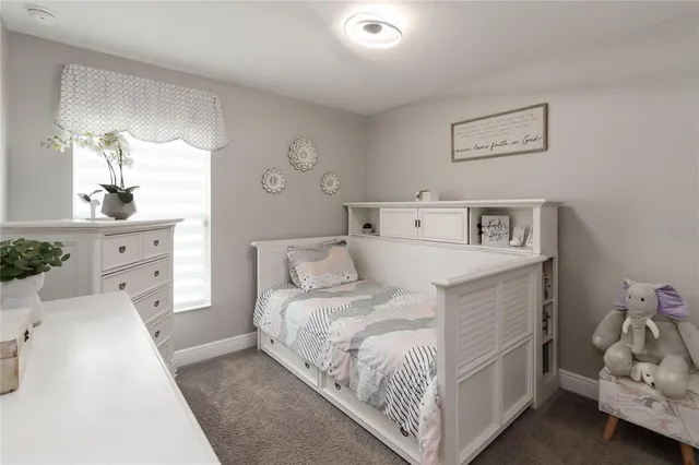 a bathroom with a granite countertop sink a toilet and a mirror