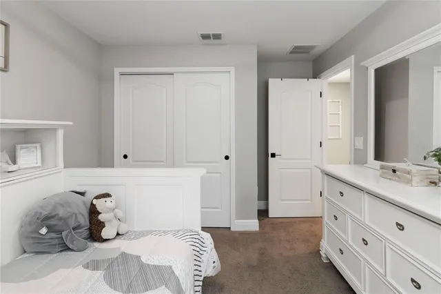 a bathroom with a shower and a mirror