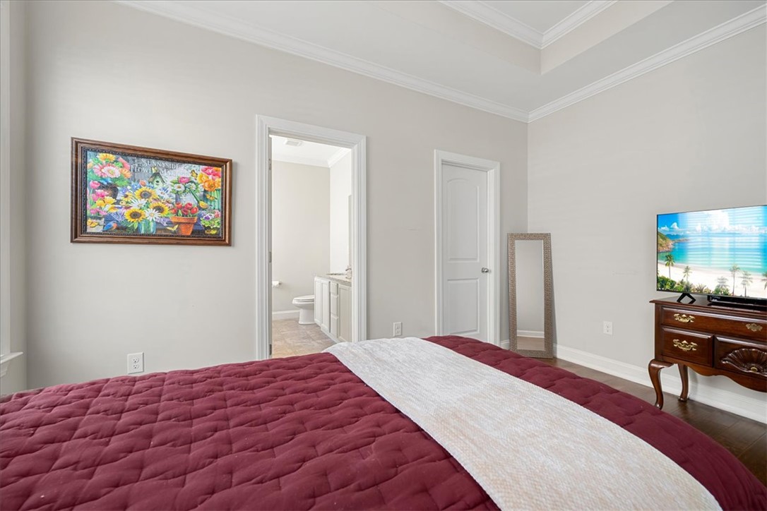 21 Barron Glenn Way Anderson, SC 29621 - Photo 29 of 48 This spacious Primary Bedroom offers elegant crown molding and convenient en-suite bathroom.