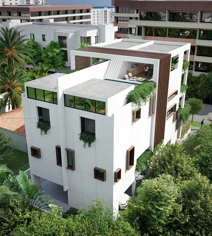 an aerial view of a house with yard