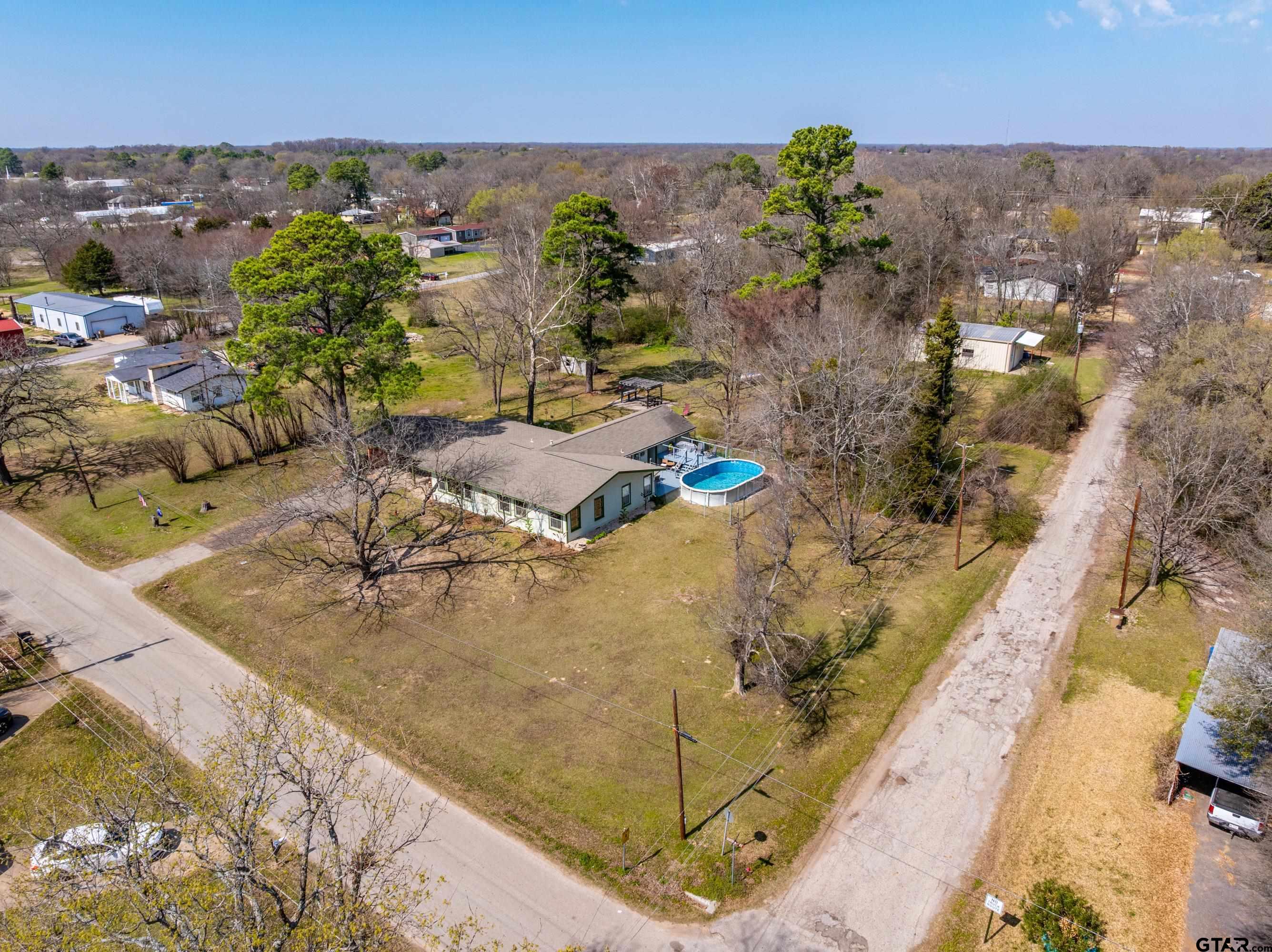 609 East Quitman Street Alba, TX 75410 - Photo 3 of 38 an aerial view of residential houses with outdoor space