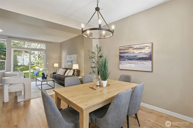 a view of a dining room with furniture window and wooden floor