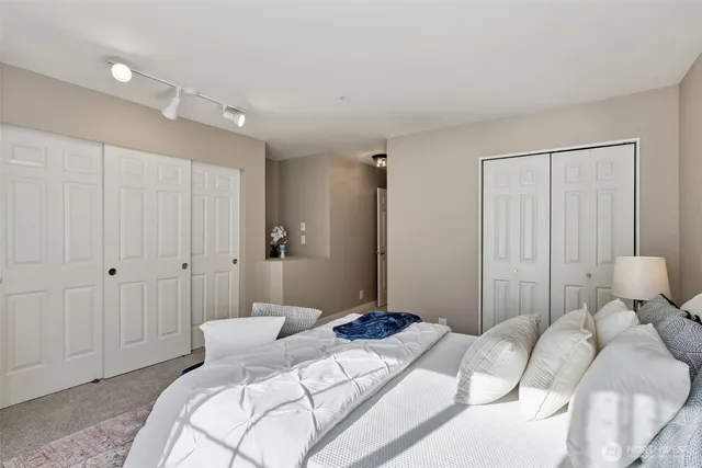 a bedroom with a bed and a closet