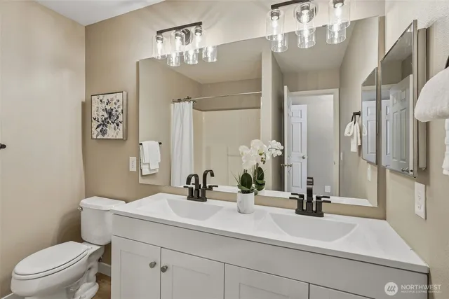 a room with a stove and a microwave