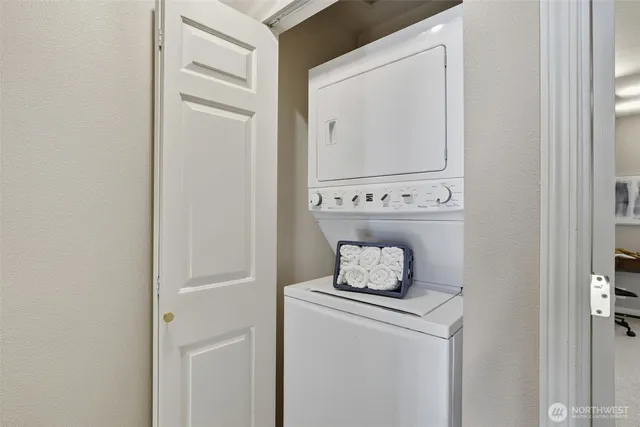 a view of a chairs and table in the back yard