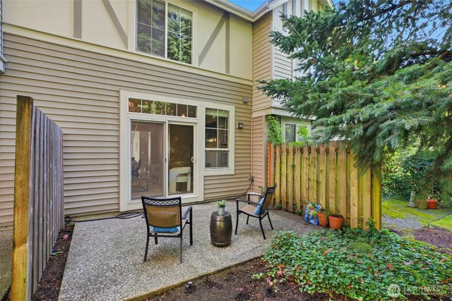 a view of a house with pool and a yard