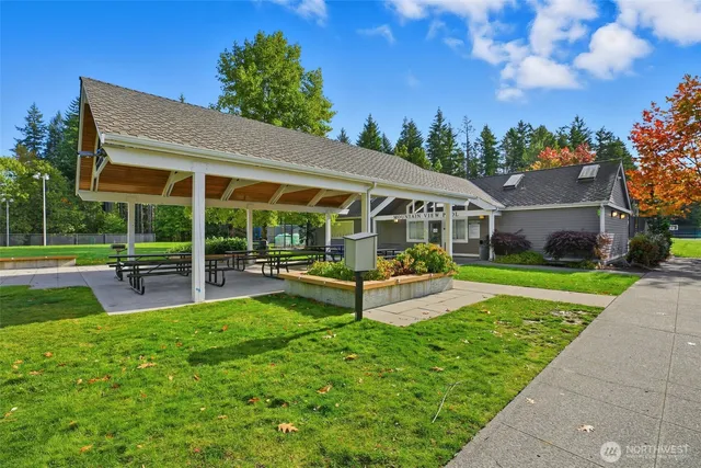 a view of swimming pool with a patio
