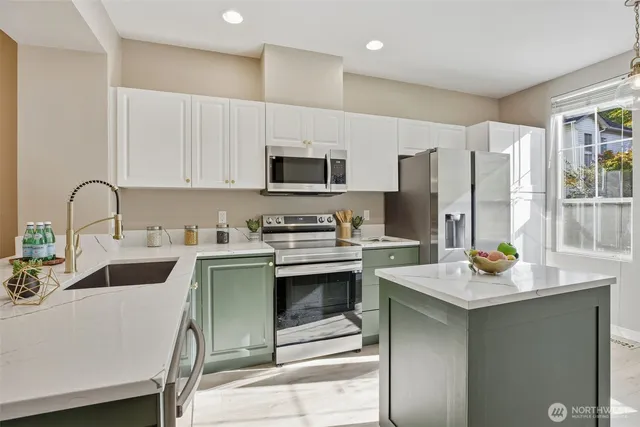 a kitchen with a sink stove and refrigerator
