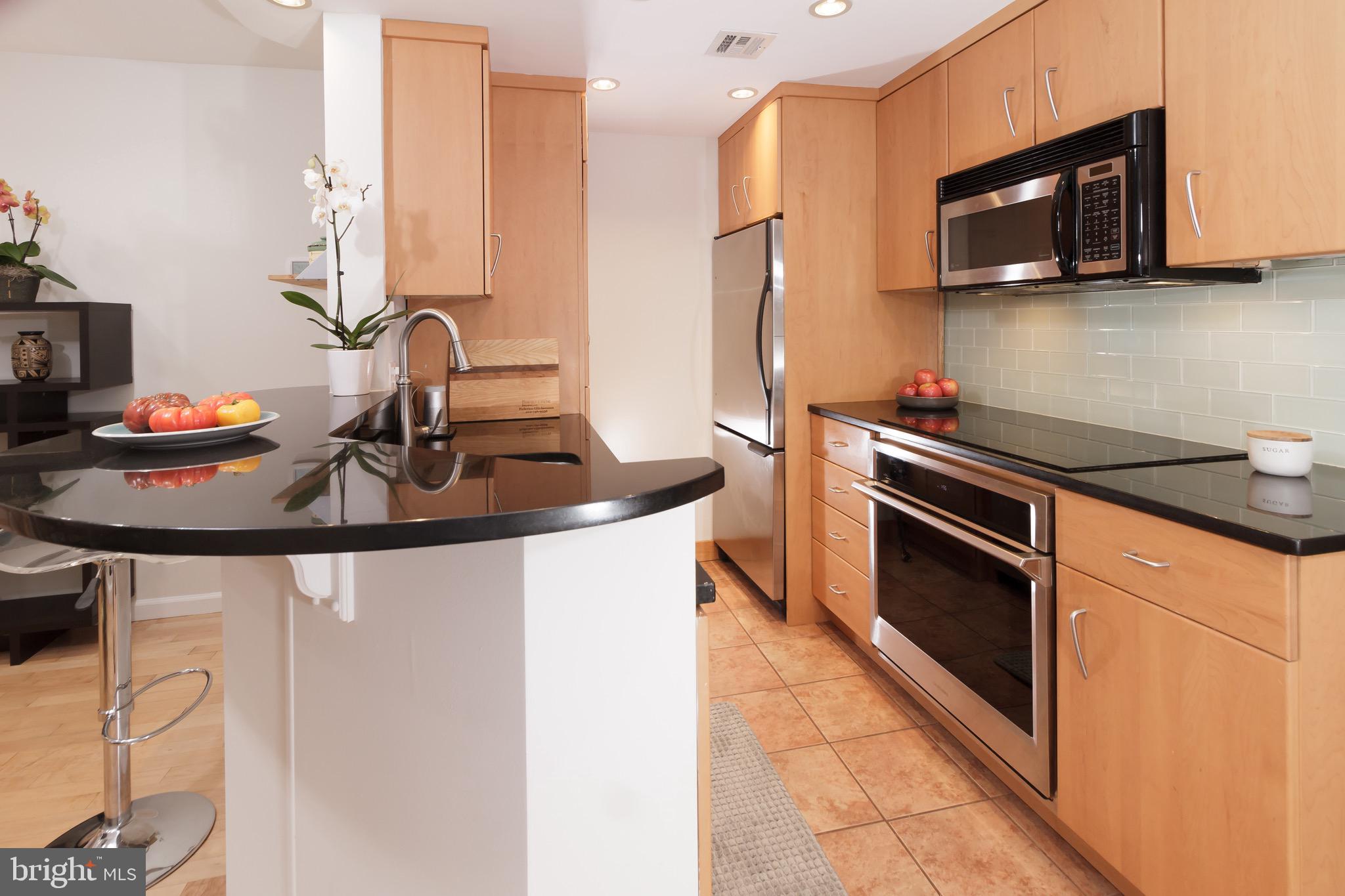 1810 Kalorama Road Northwest, Unit A2 Washington, DC 20009 - Photo 7 of 22 Great galley kitchen with ounter with eating space