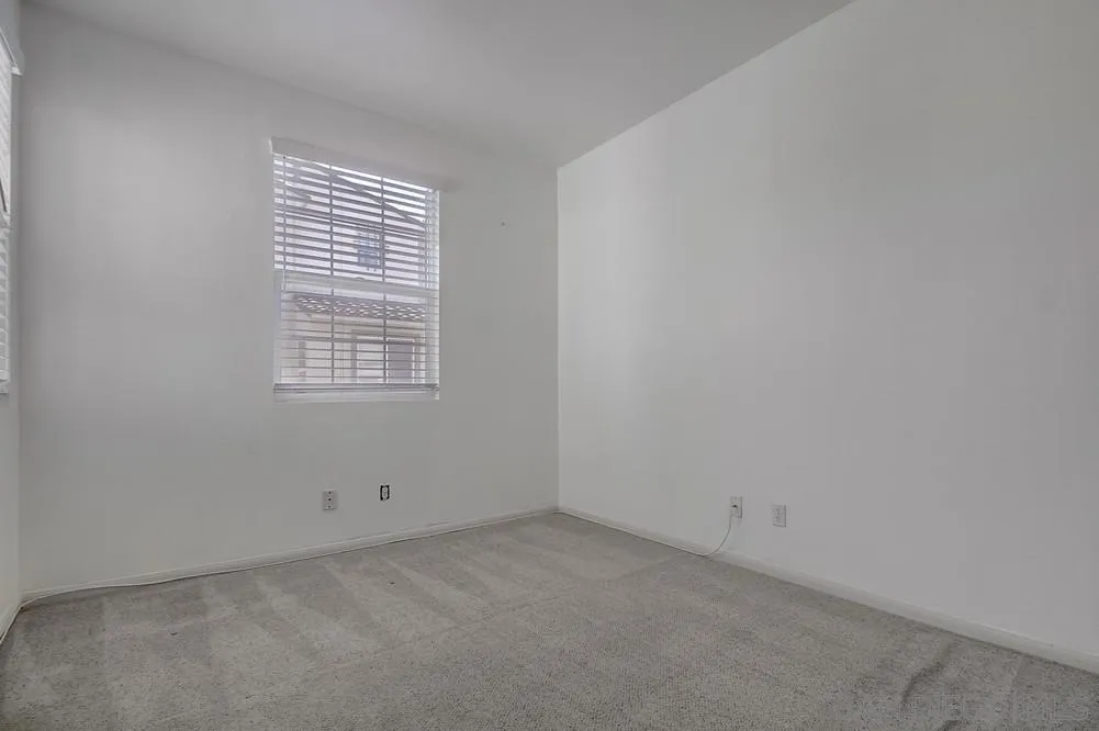 1298 Fools Gold Way, Unit 4 Chula Vista, CA 91913 - Photo 27 of 38 an empty room with a window