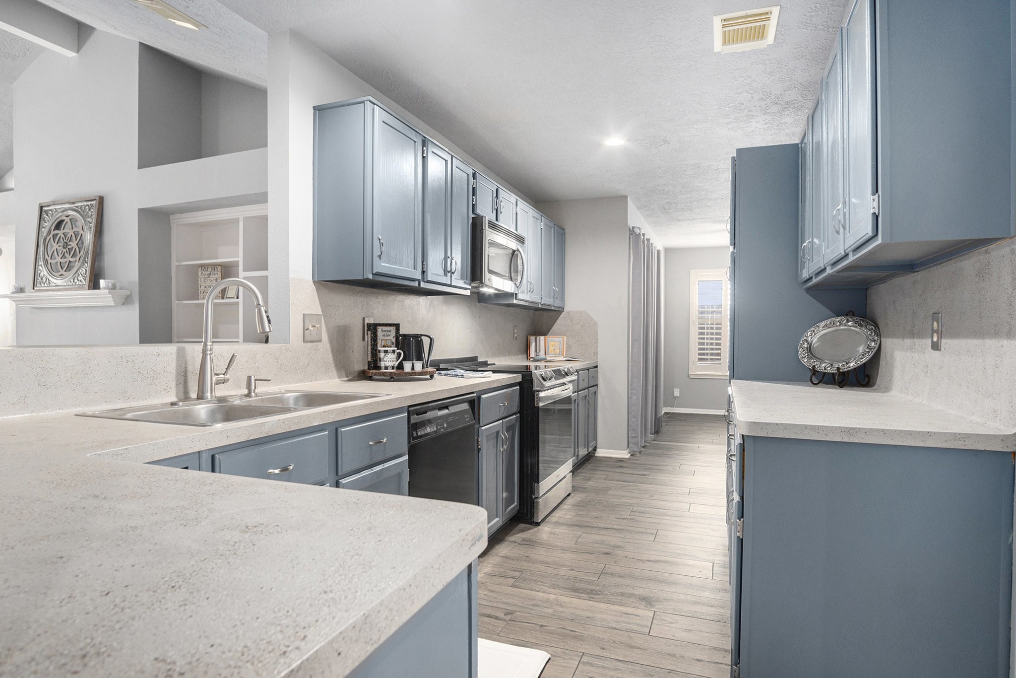 3315 Mourning Dove Drive Spring, TX 77388 - Photo 13 of 44 a kitchen with stainless steel appliances granite countertop a sink a stove and refrigerator
