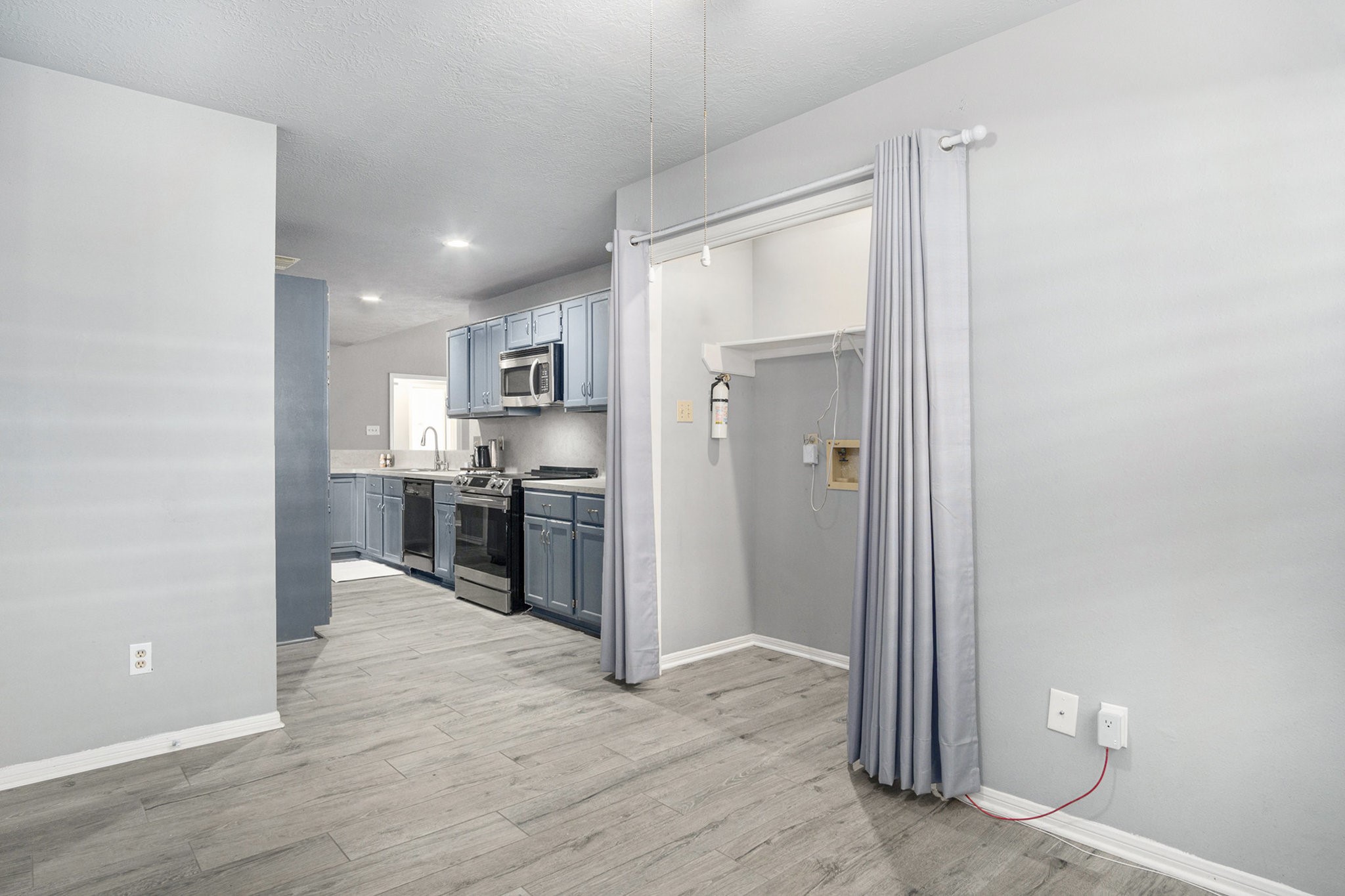 3315 Mourning Dove Drive Spring, TX 77388 - Photo 19 of 44 a view of a kitchen with refrigerator and wooden floor