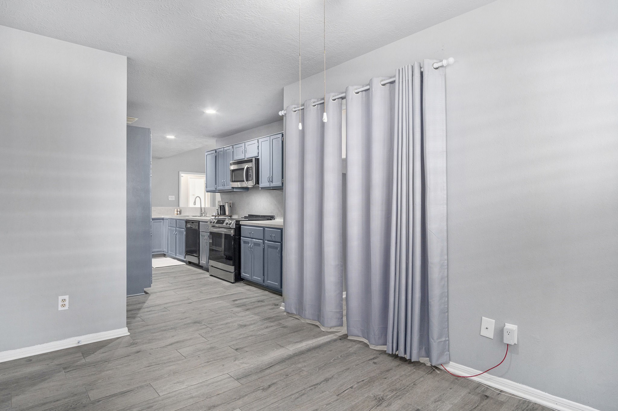 3315 Mourning Dove Drive Spring, TX 77388 - Photo 20 of 44 a view of a kitchen with wooden floor and electronic appliances