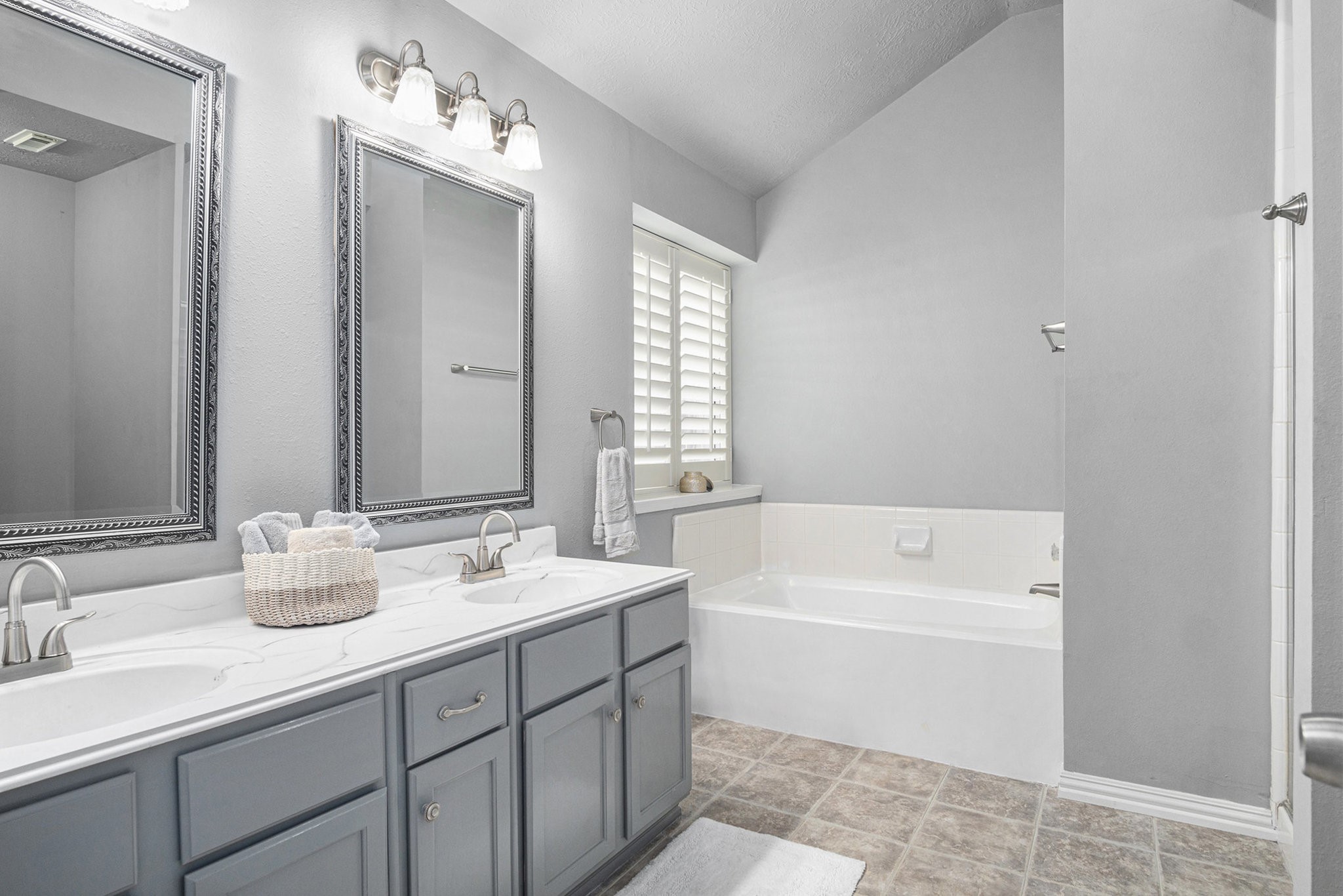 3315 Mourning Dove Drive Spring, TX 77388 - Photo 30 of 44 a bathroom with a tub sink and mirror