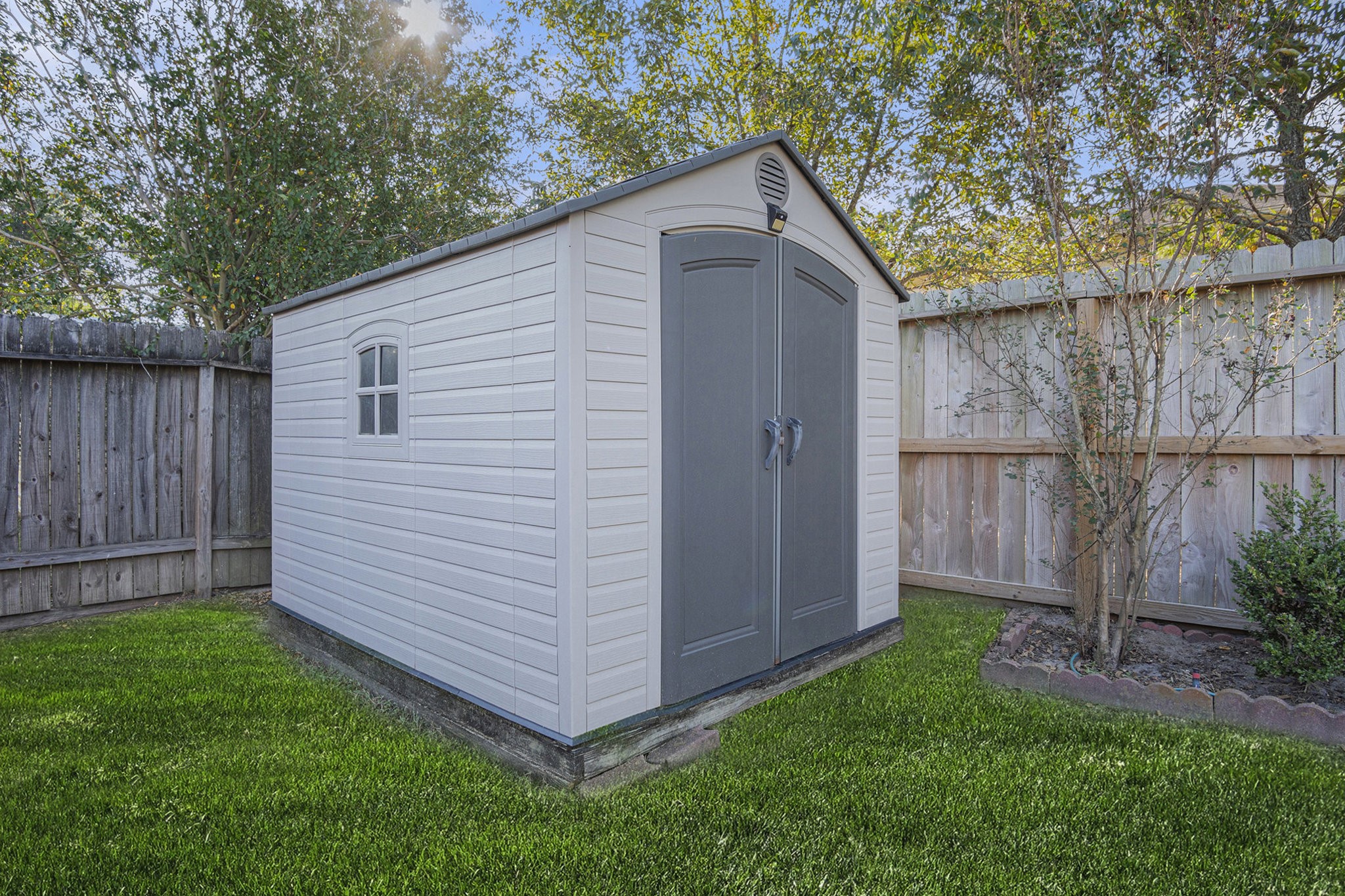 3315 Mourning Dove Drive Spring, TX 77388 - Photo 41 of 44 a view of backyard with small cabin and wooden fence