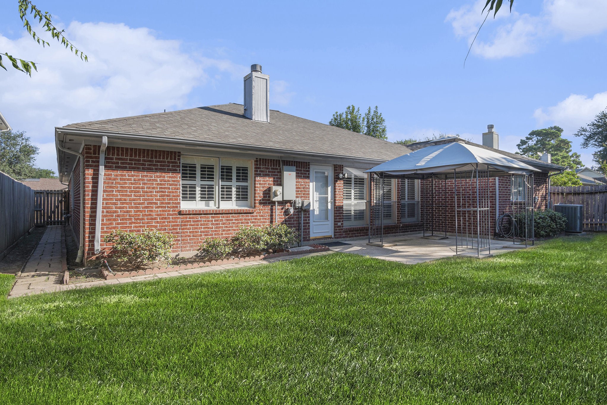 3315 Mourning Dove Drive Spring, TX 77388 - Photo 42 of 44 a front view of a house with a garden