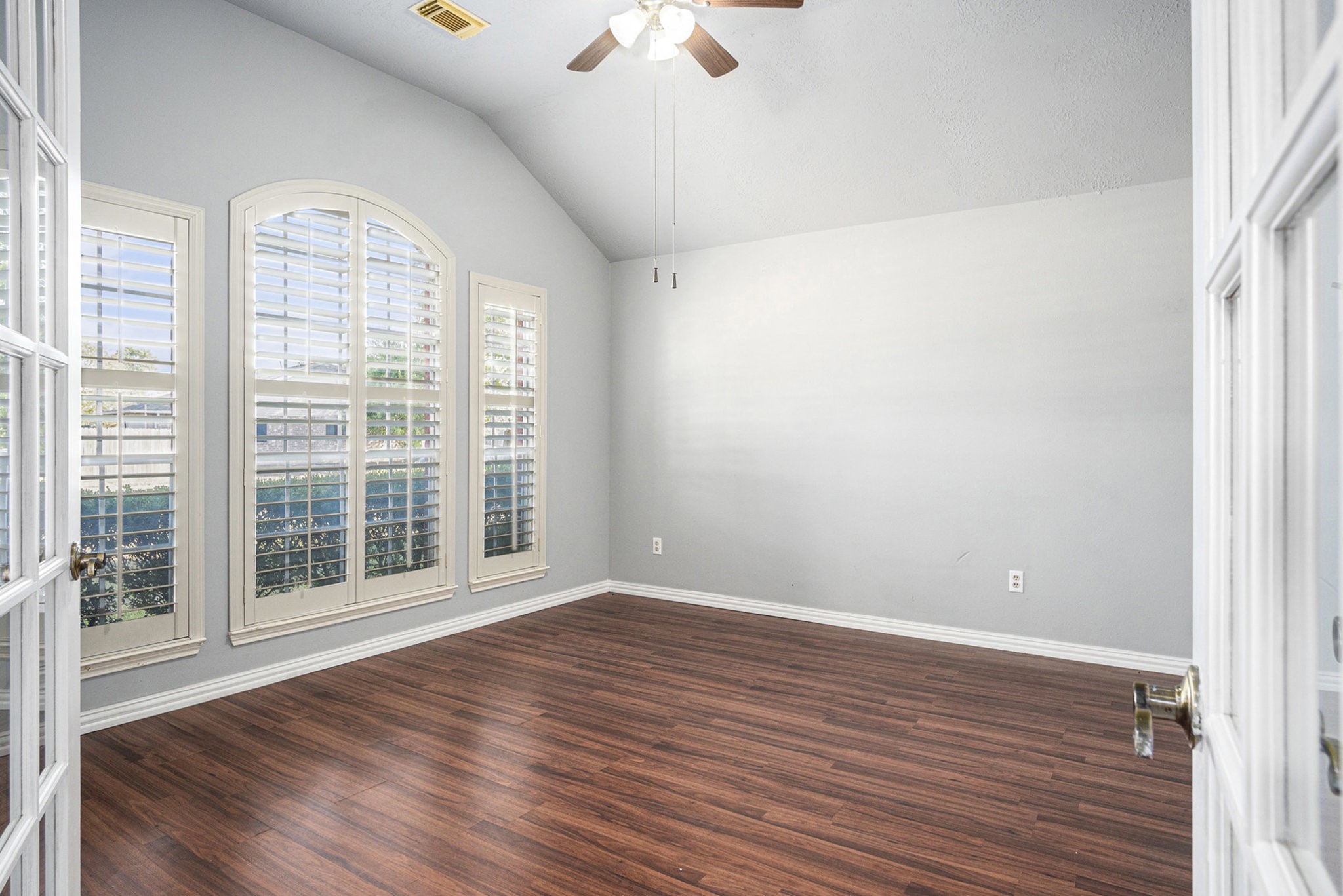 3315 Mourning Dove Drive Spring, TX 77388 - Photo 7 of 44 a view of an empty room with wooden floor and a window