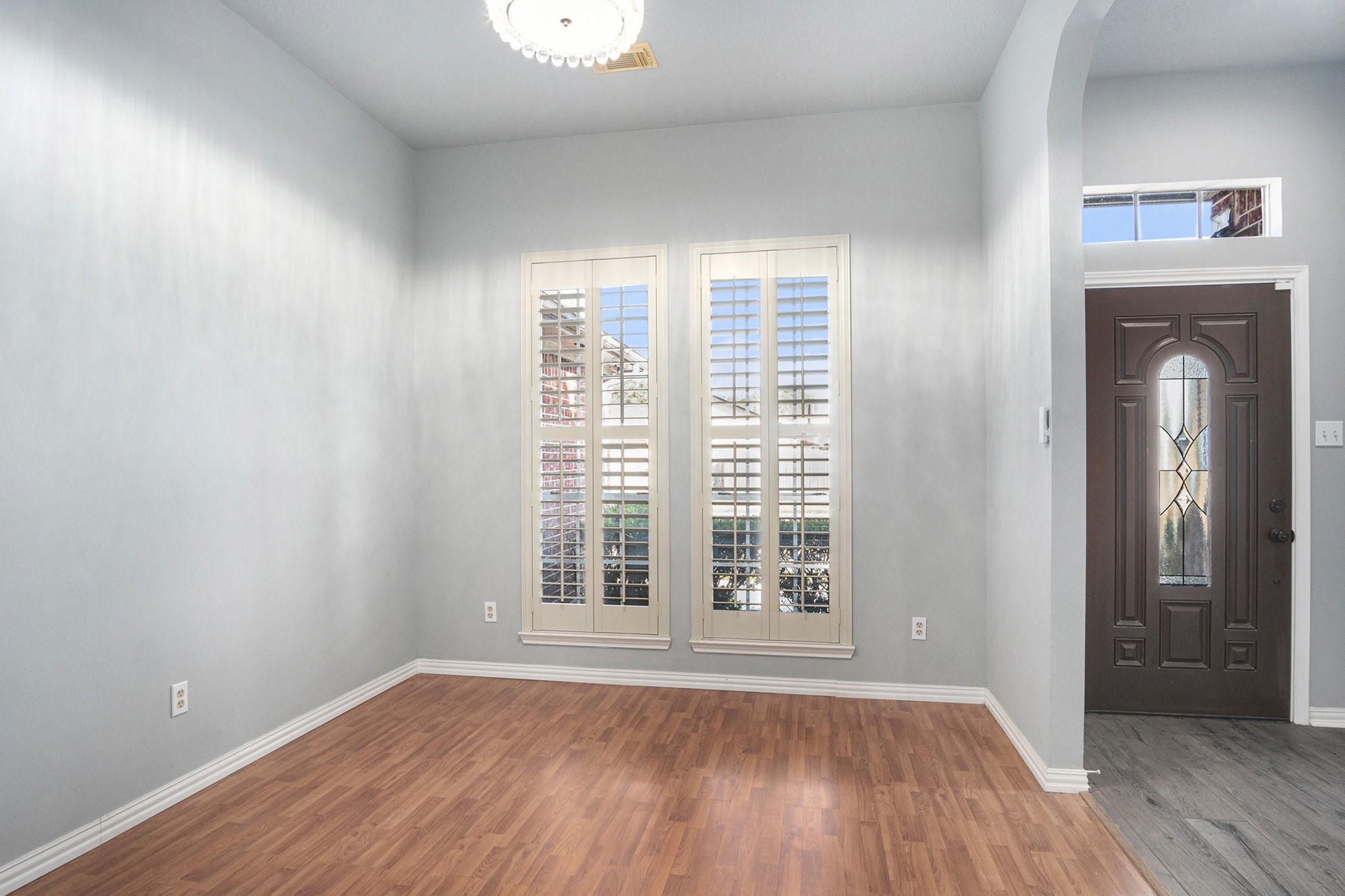 3315 Mourning Dove Drive Spring, TX 77388 - Photo 9 of 44 an empty room with wooden floor and windows
