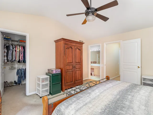 a bedroom with furniture and closet