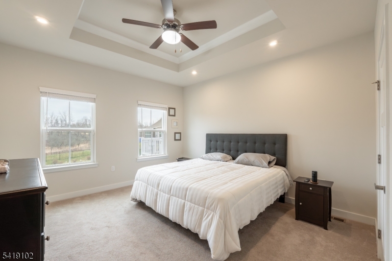18 Sparrowhawk Street Washington, NJ 07882 - Photo 13 of 31 a bedroom with a large bed and a window