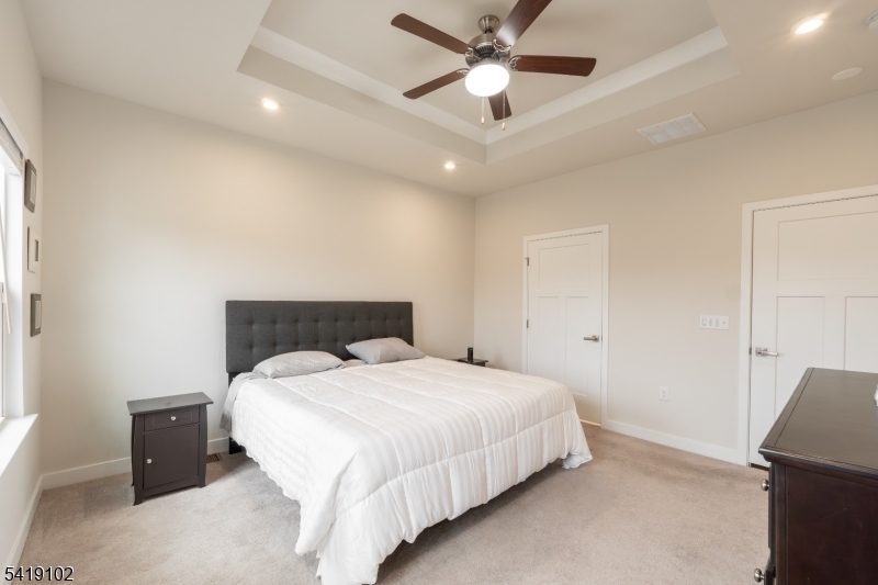 18 Sparrowhawk Street Washington, NJ 07882 - Photo 14 of 31 a spacious bedroom with a bed and a ceiling fan