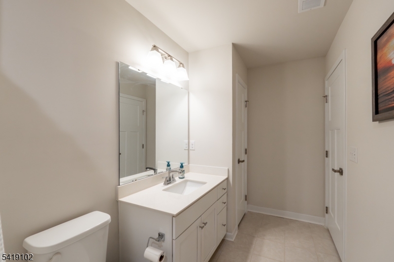 18 Sparrowhawk Street Washington, NJ 07882 - Photo 19 of 31 a bathroom with a sink toilet and mirror