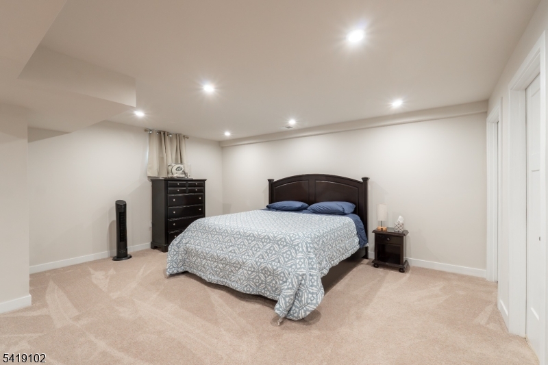 18 Sparrowhawk Street Washington, NJ 07882 - Photo 21 of 31 a spacious bedroom with a bed and a desk in it