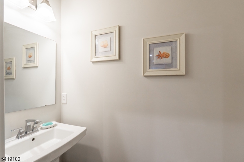 18 Sparrowhawk Street Washington, NJ 07882 - Photo 23 of 31 a bathroom with a sink and a mirror