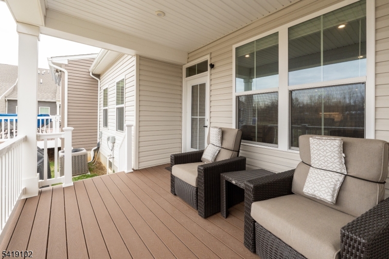 18 Sparrowhawk Street Washington, NJ 07882 - Photo 3 of 31 a view of a patio with couches and table with wooden floor