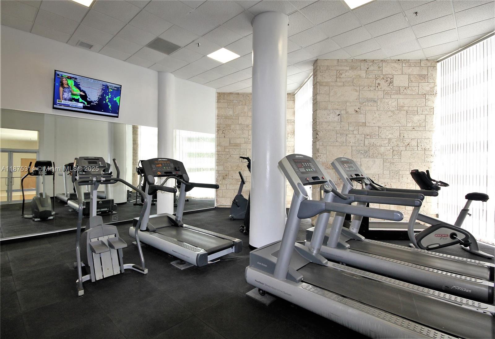5161 Collins Avenue, Unit 603 Miami Beach, FL 33140 - Photo 32 of 56 a view of a room with gym equipment