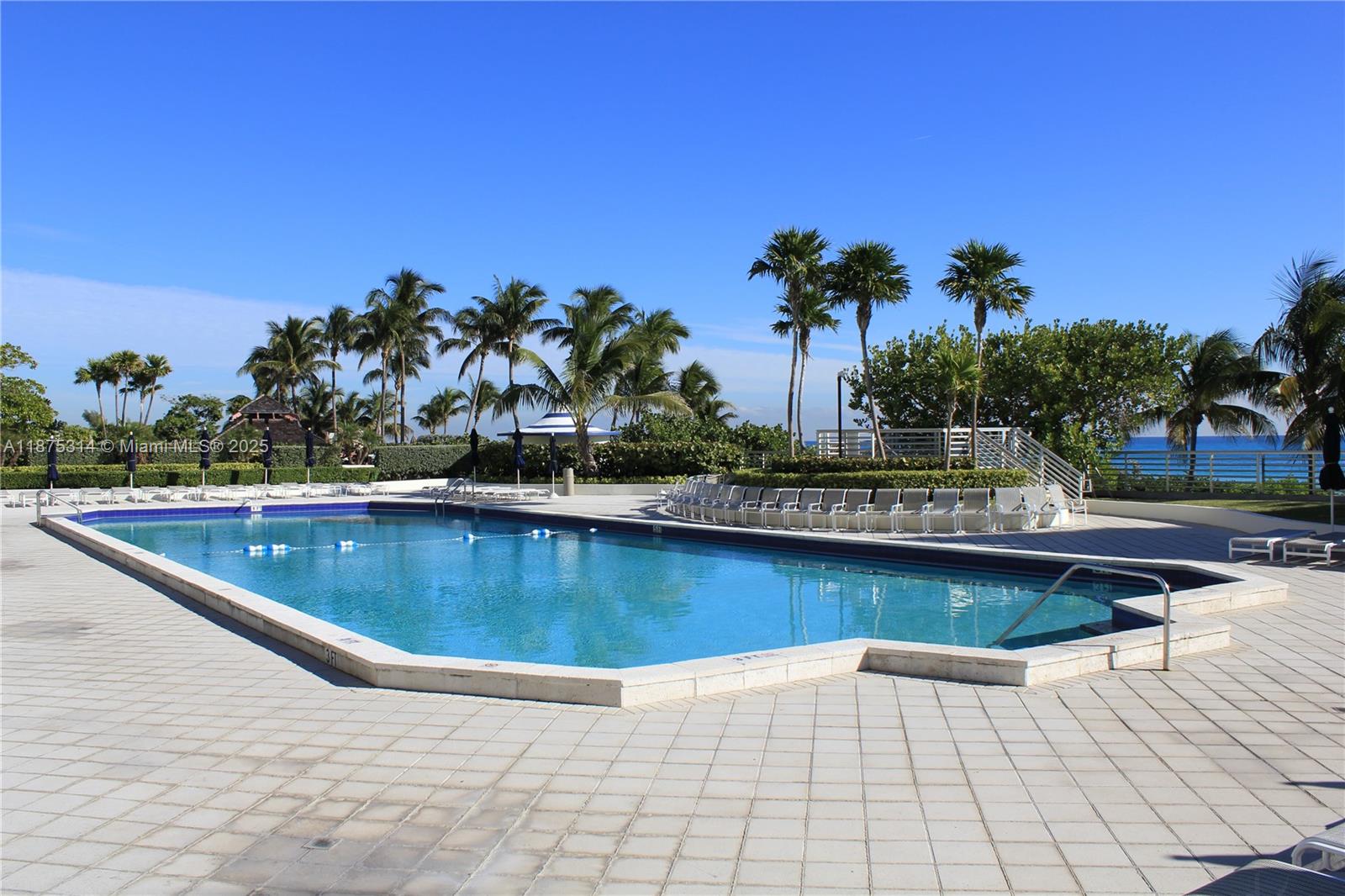 5161 Collins Avenue, Unit 603 Miami Beach, FL 33140 - Photo 39 of 56 a view of outdoor space with swimming pool and lounge chair