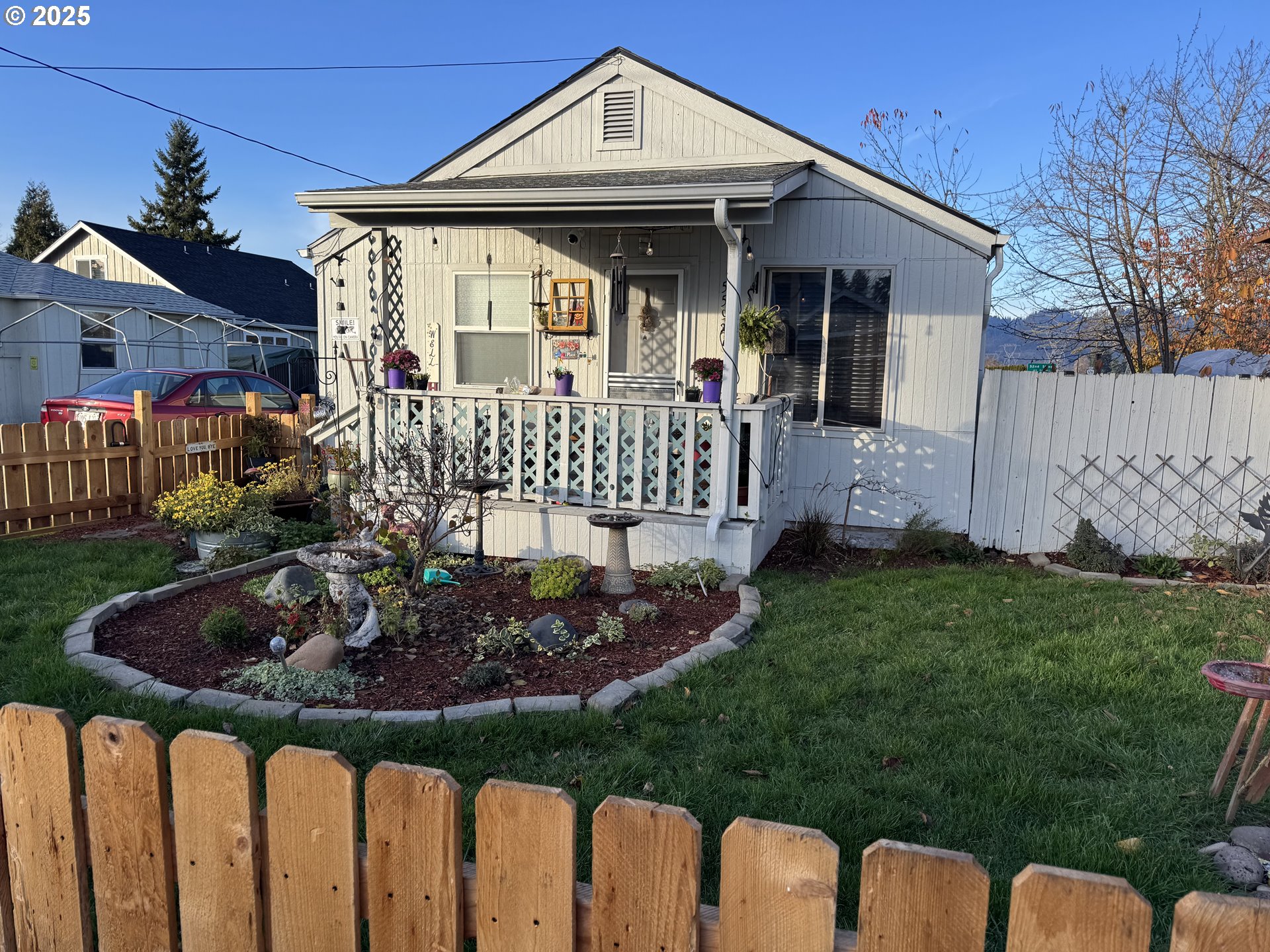 a front view of house and yard with green space