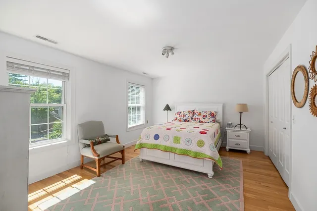 a bedroom with furniture and a window