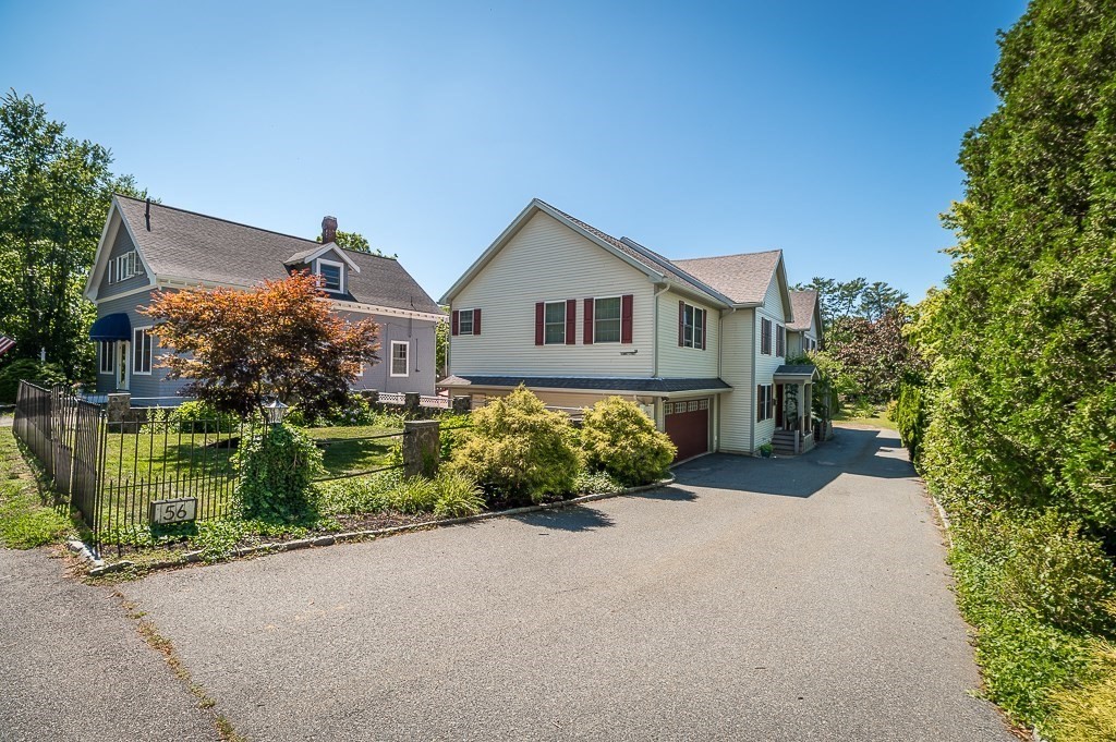 56 Summer Street, Unit A Manchester, MA 01944 - Photo 30 of 35 a front view of a house with a garden