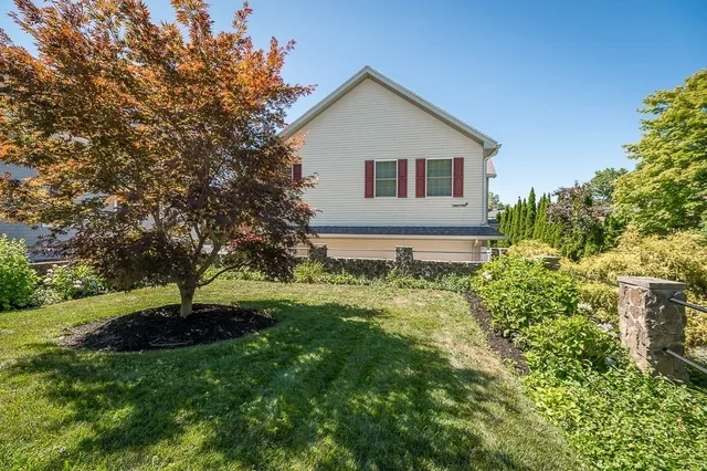 a house with a big yard and large trees