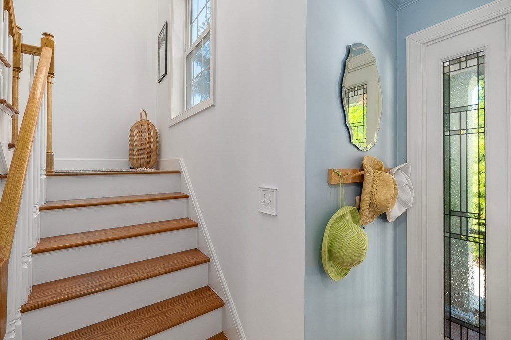56 Summer Street, Unit A Manchester, MA 01944 - Photo 5 of 35 a view of entryway and hall with wooden floor