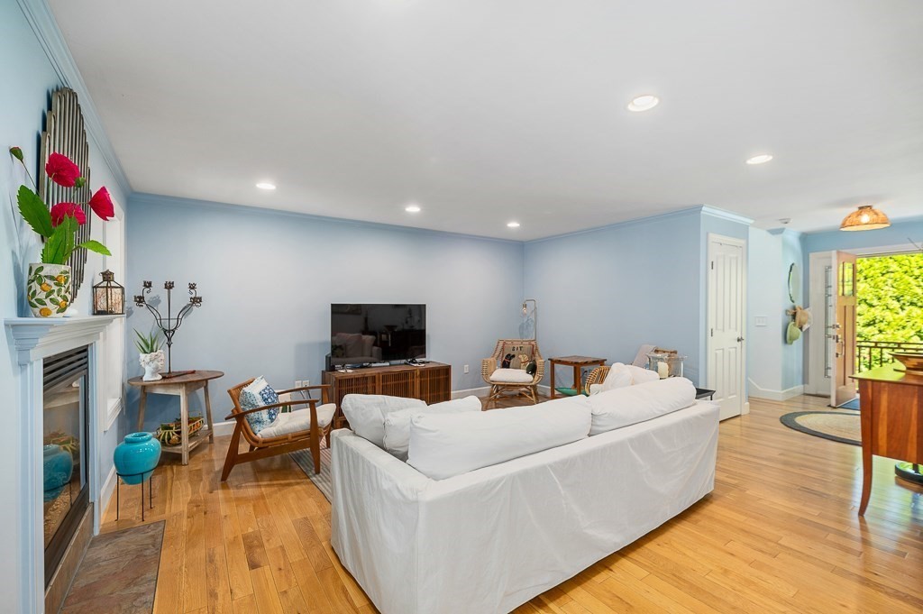 56 Summer Street, Unit A Manchester, MA 01944 - Photo 9 of 35 a living room with furniture and a flat screen tv