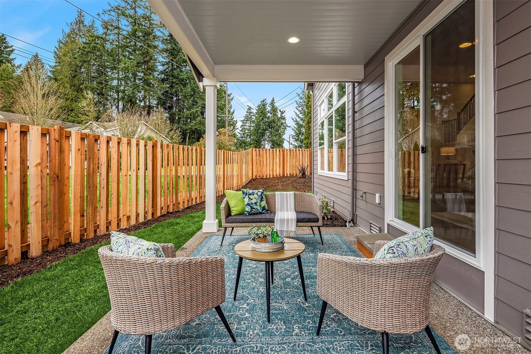 9207 Northeast 175th Street, Unit A Bothell, WA 98011 - Photo 13 of 38 a view of a chair and table in back yard of the house