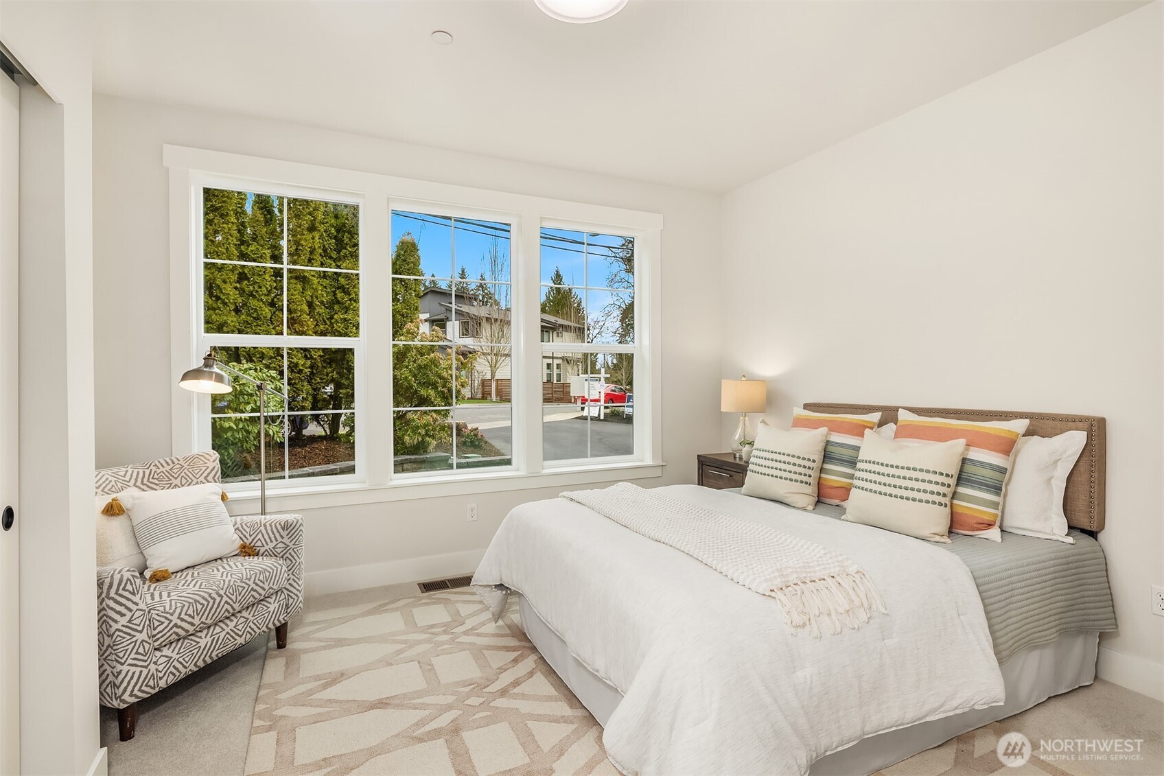 9207 Northeast 175th Street, Unit A Bothell, WA 98011 - Photo 17 of 38 a bedroom with furniture and a large window