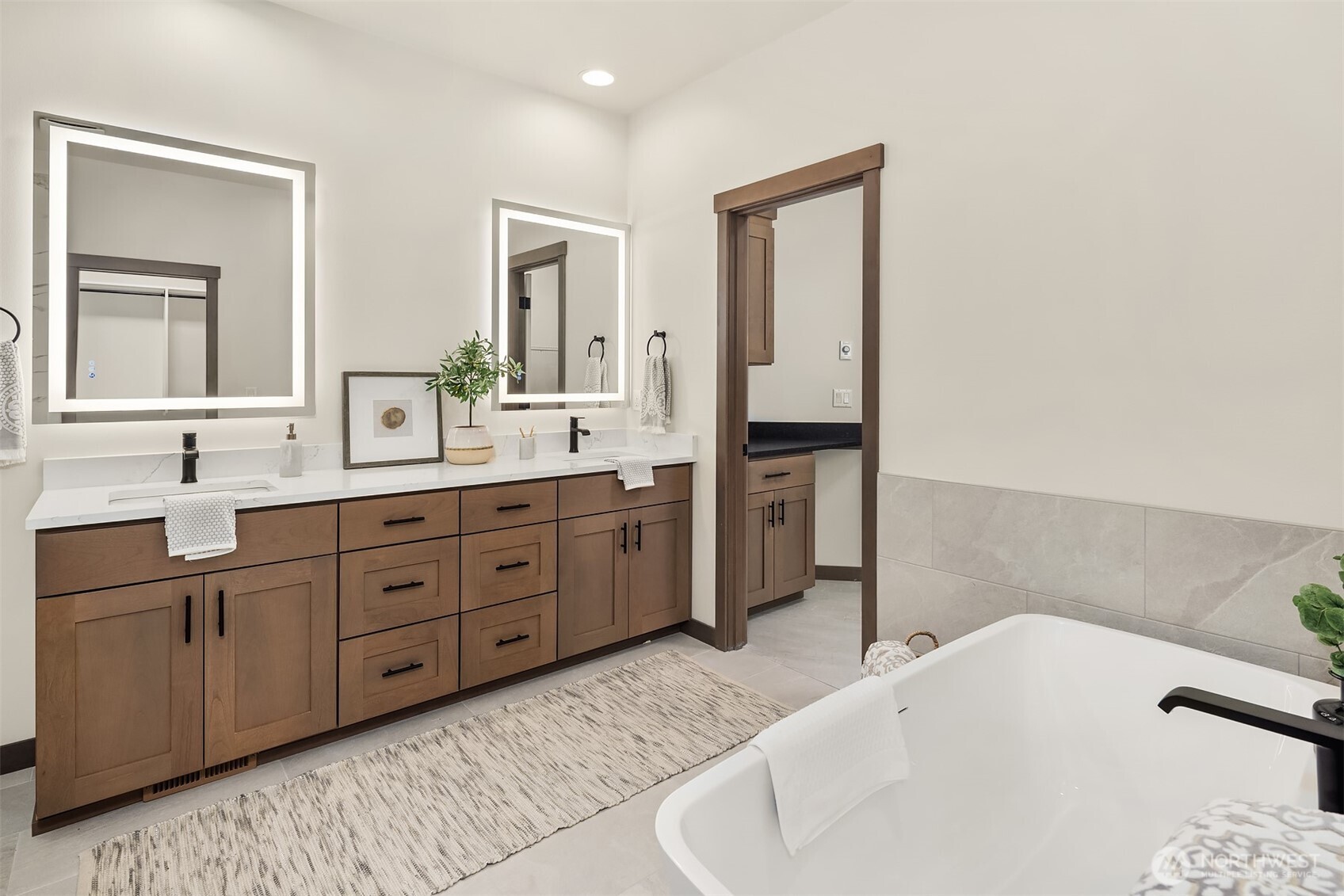 9207 Northeast 175th Street, Unit A Bothell, WA 98011 - Photo 20 of 38 a spacious bathroom with a tub sink and mirror