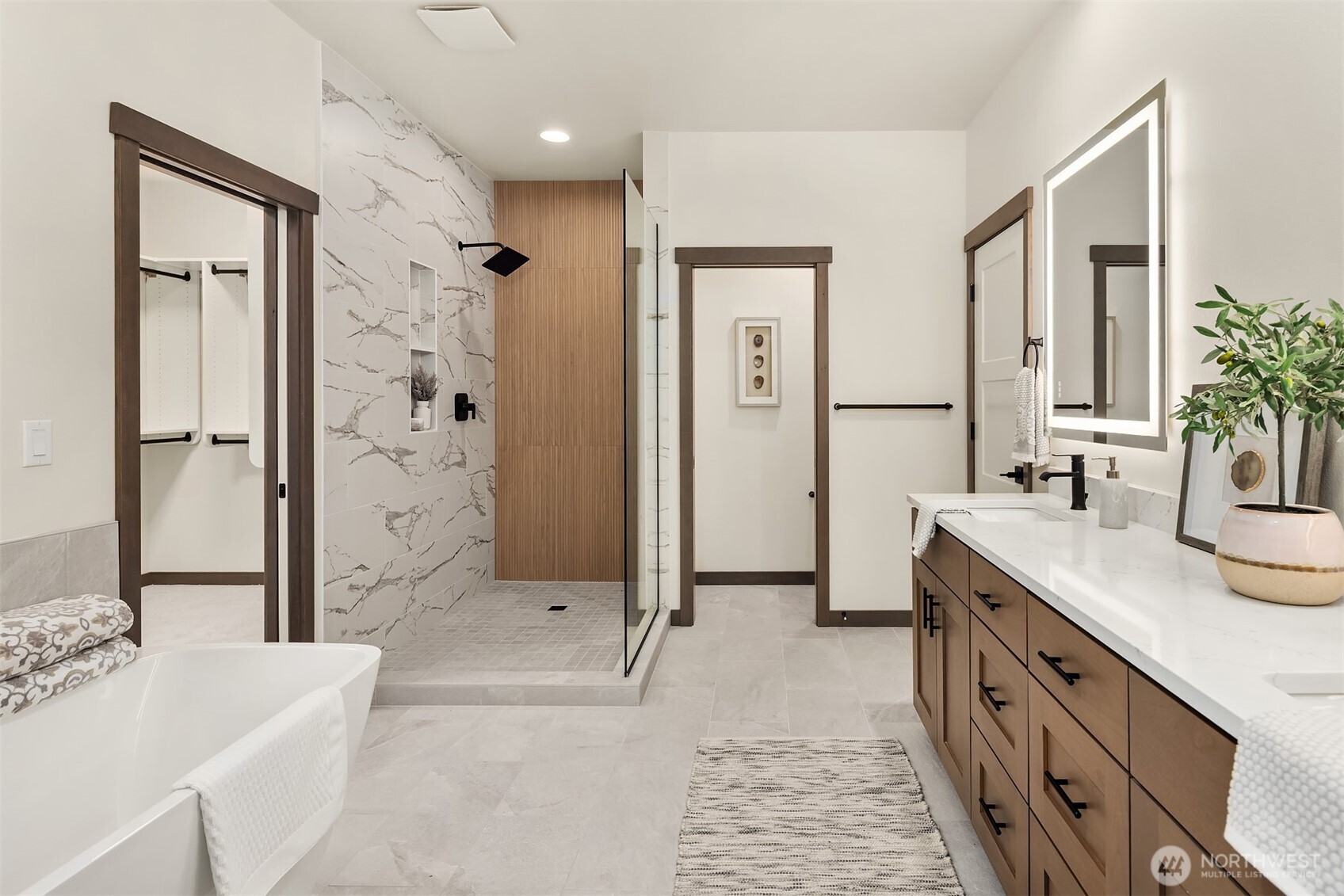 9207 Northeast 175th Street, Unit A Bothell, WA 98011 - Photo 21 of 38 a spacious bathroom with a granite countertop sink mirror and shower