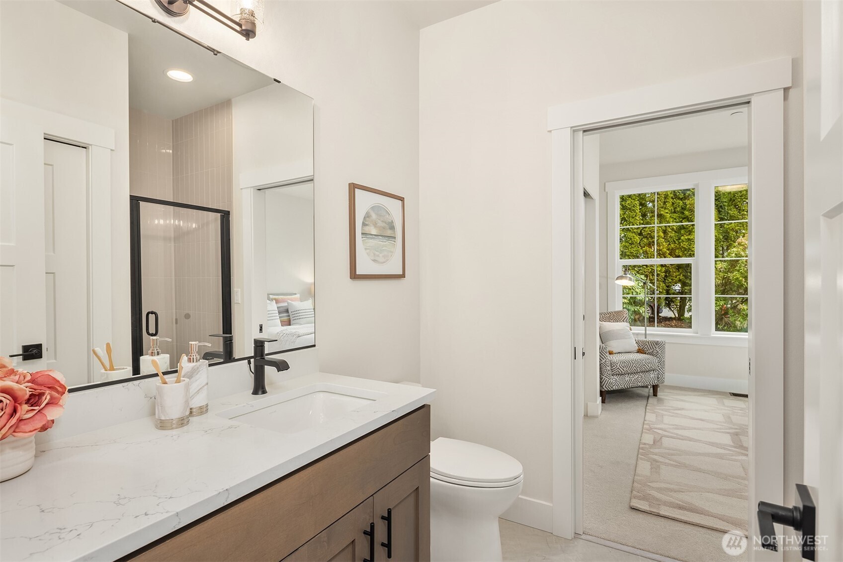 9207 Northeast 175th Street, Unit A Bothell, WA 98011 - Photo 27 of 38 a bathroom with a sink toilet and a mirror