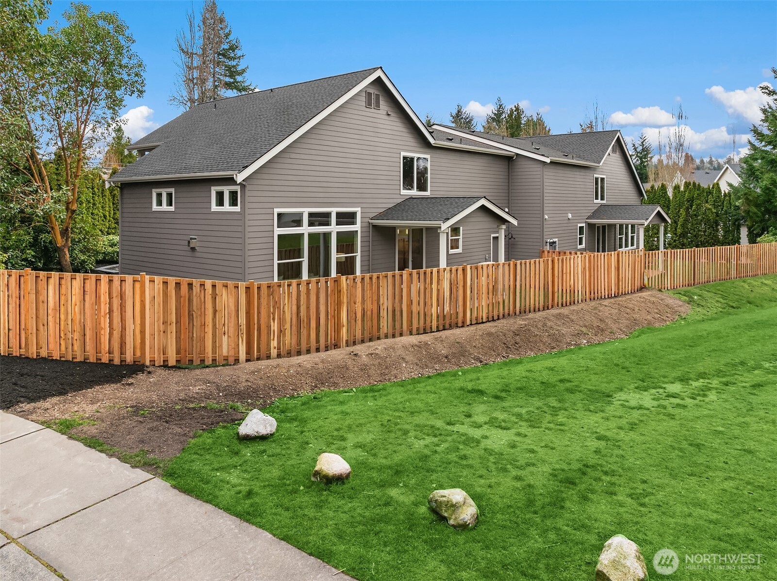 9207 Northeast 175th Street, Unit A Bothell, WA 98011 - Photo 34 of 38 a front view of a house with garden