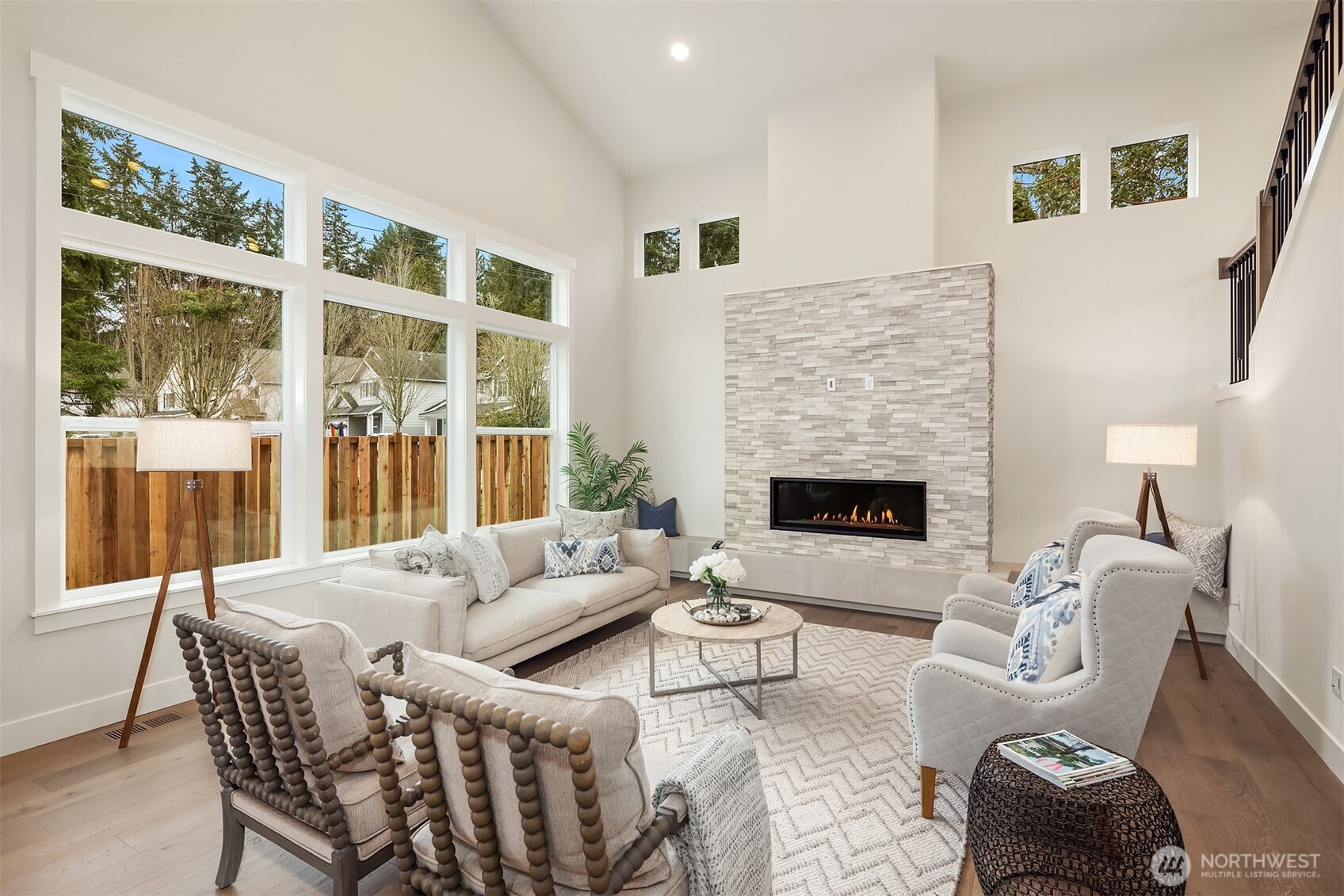 9207 Northeast 175th Street, Unit A Bothell, WA 98011 - Photo 5 of 38 a living room with furniture and a fireplace